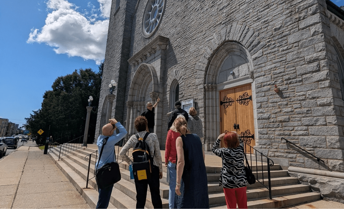 NEFP2025 tour group on steps at 1st Church Concord NH